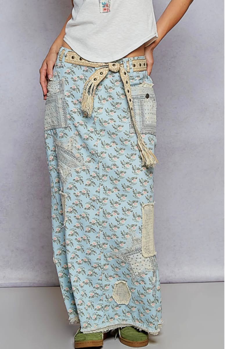 Blue floral patchwork maxi skirt with textured pockets.